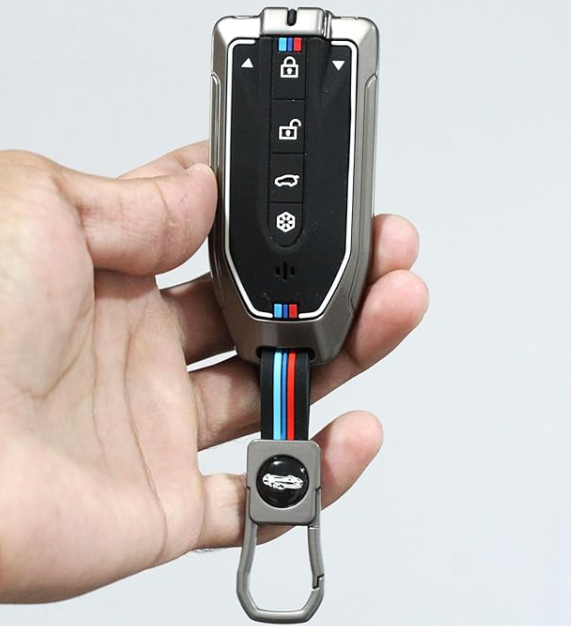 Hand holding a car key fob with BMW logo on a light gray background