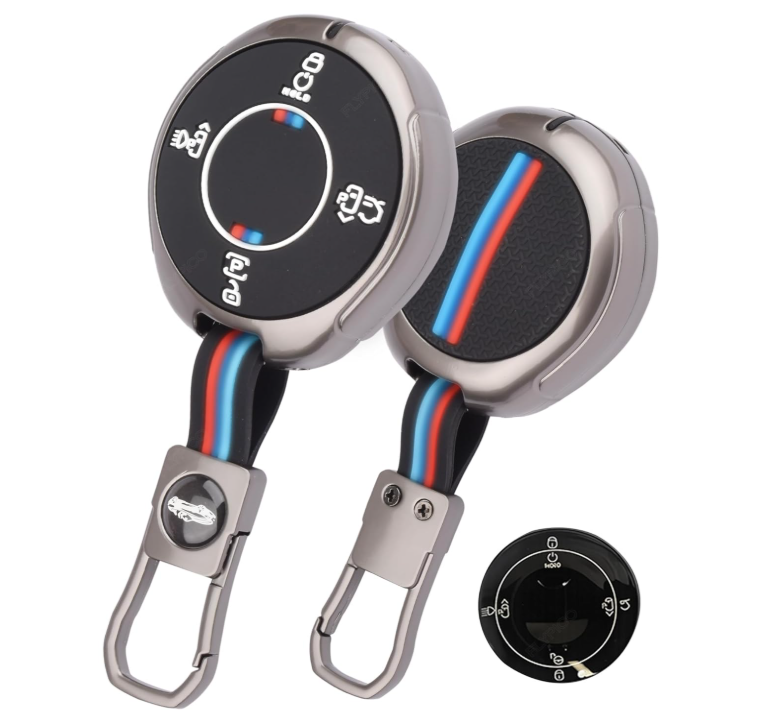 Two car key fobs with retractable straps on a white background