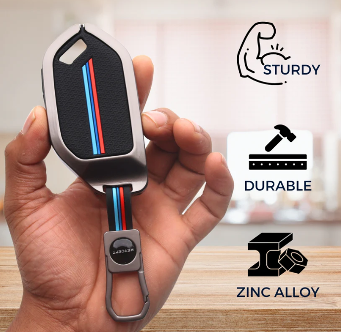 Key cover with carabiner held in hand, labeled as sturdy, durable, and made of zinc alloy.