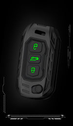 Black remote control with green buttons on a black background